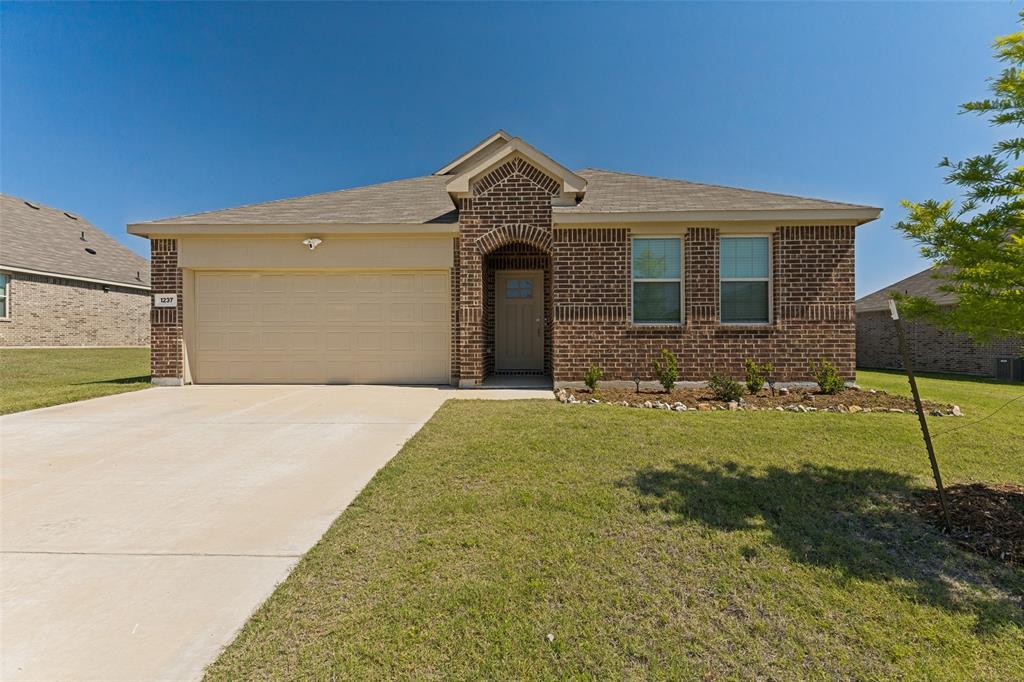 1237 Almond Road Azle, TX 76020 - Photo 1 of 24 a front view of a house with a yard