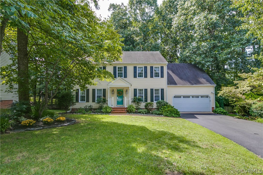 5302 Chestnut Bluff Road Midlothian, VA 23112 - Photo 3 of 50 a front view of a house with a garden