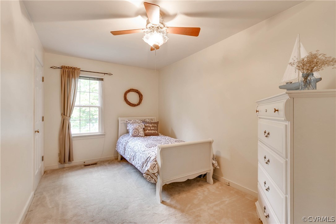 5302 Chestnut Bluff Road Midlothian, VA 23112 - Photo 40 of 50 a bedroom with a bed dresser and a window