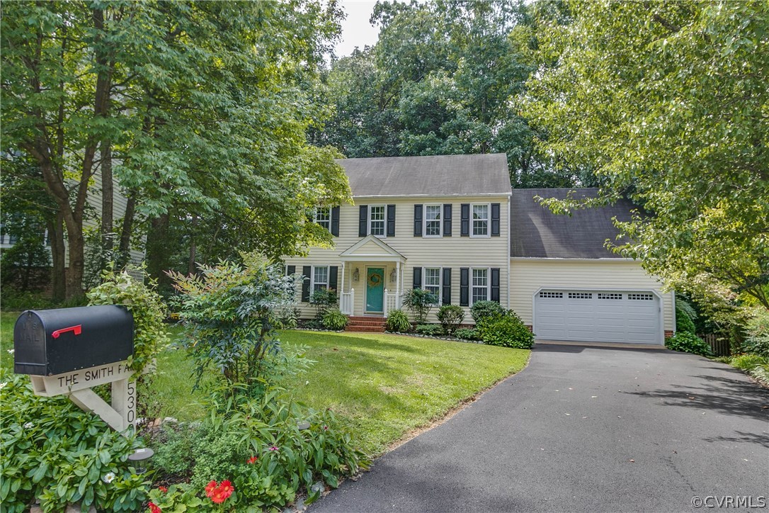 5302 Chestnut Bluff Road Midlothian, VA 23112 - Photo 7 of 50 a front view of a house with a garden