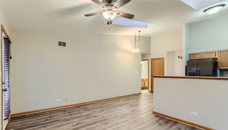 Undisclosed Address Round Lake Beach, IL 60073 - Photo 4 of 10 a view of a kitchen with wooden floor