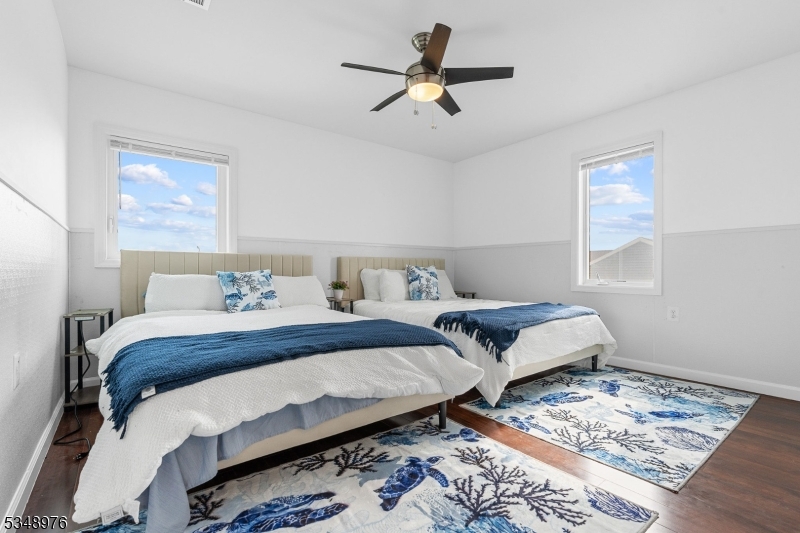 129 Franklin Avenue, Unit B Seaside Heights, NJ 08751 - Photo 11 of 22 a bedroom with a bed and wooden floor