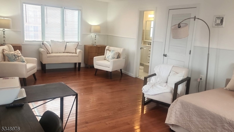 129 Franklin Avenue, Unit B Seaside Heights, NJ 08751 - Photo 13 of 22 a living room with furniture and a large window