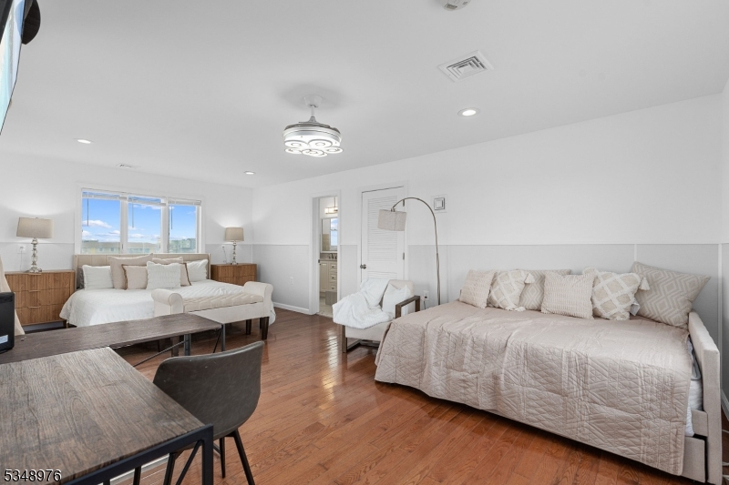 129 Franklin Avenue, Unit B Seaside Heights, NJ 08751 - Photo 14 of 22 a living room with furniture and a chandelier