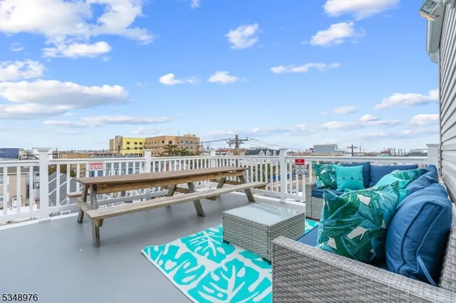 a view of a balcony with furniture