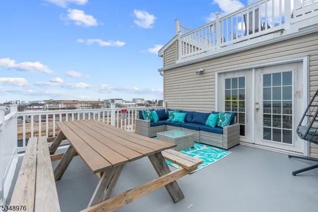 a view of a balcony with chairs
