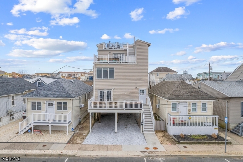 129 Franklin Avenue, Unit B Seaside Heights, NJ 08751 - Photo 20 of 22 a view of a big house in the middle of a city