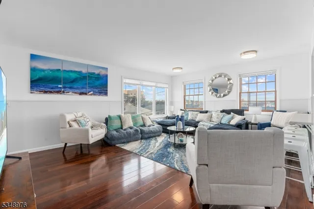 a living room with fireplace furniture and a flat screen tv