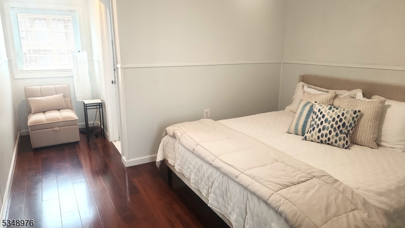 129 Franklin Avenue, Unit B Seaside Heights, NJ 08751 - Photo 7 of 22 a bedroom with a bed and a couch