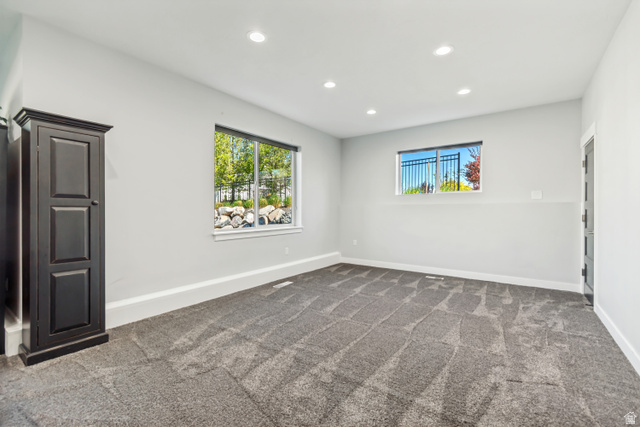1526 South 500 West Mapleton, UT 84664 - Photo 31 of 54 Basement room featuring recessed lighting, dark carpet, and healthy amount of natural light