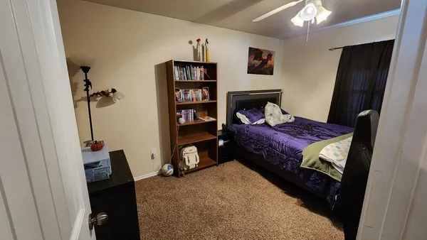 a living room with a couch and a closet