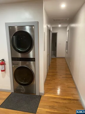a view of a hallway with washer and dryer