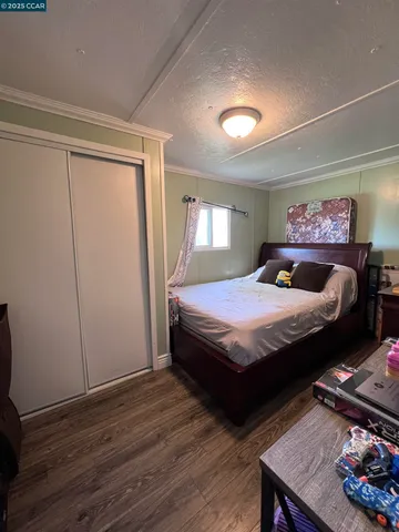 a bedroom with a bed and a table