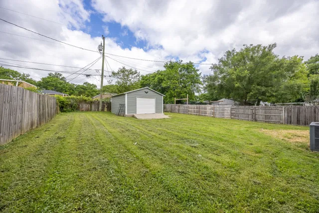 a house view with swimming pool in front of it