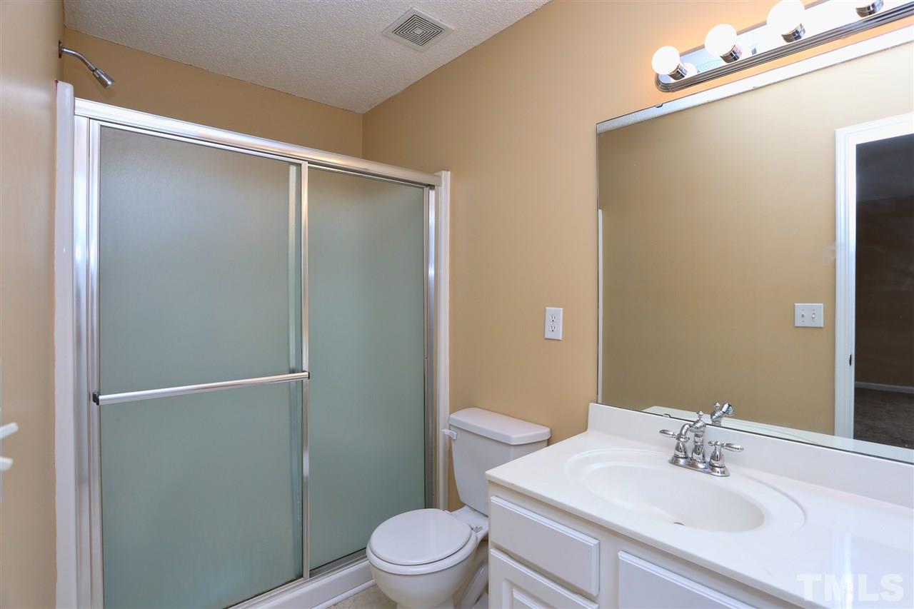2610 Quarry Ridge Lane Raleigh, NC 27610 - Photo 14 of 23 a bathroom with a sink a toilet and shower