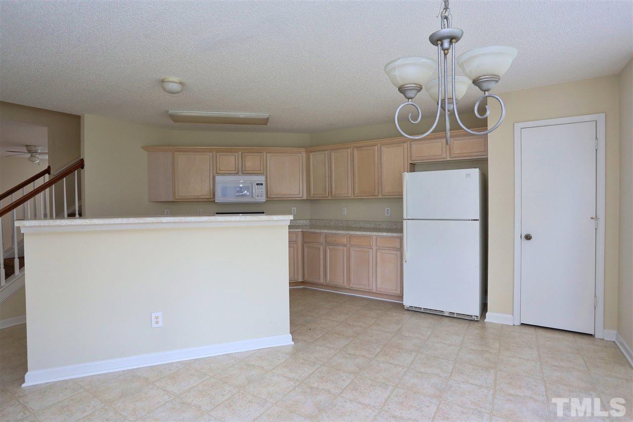 2610 Quarry Ridge Lane Raleigh, NC 27610 - Photo 9 of 23 a utility room with cabinets washer and dryer
