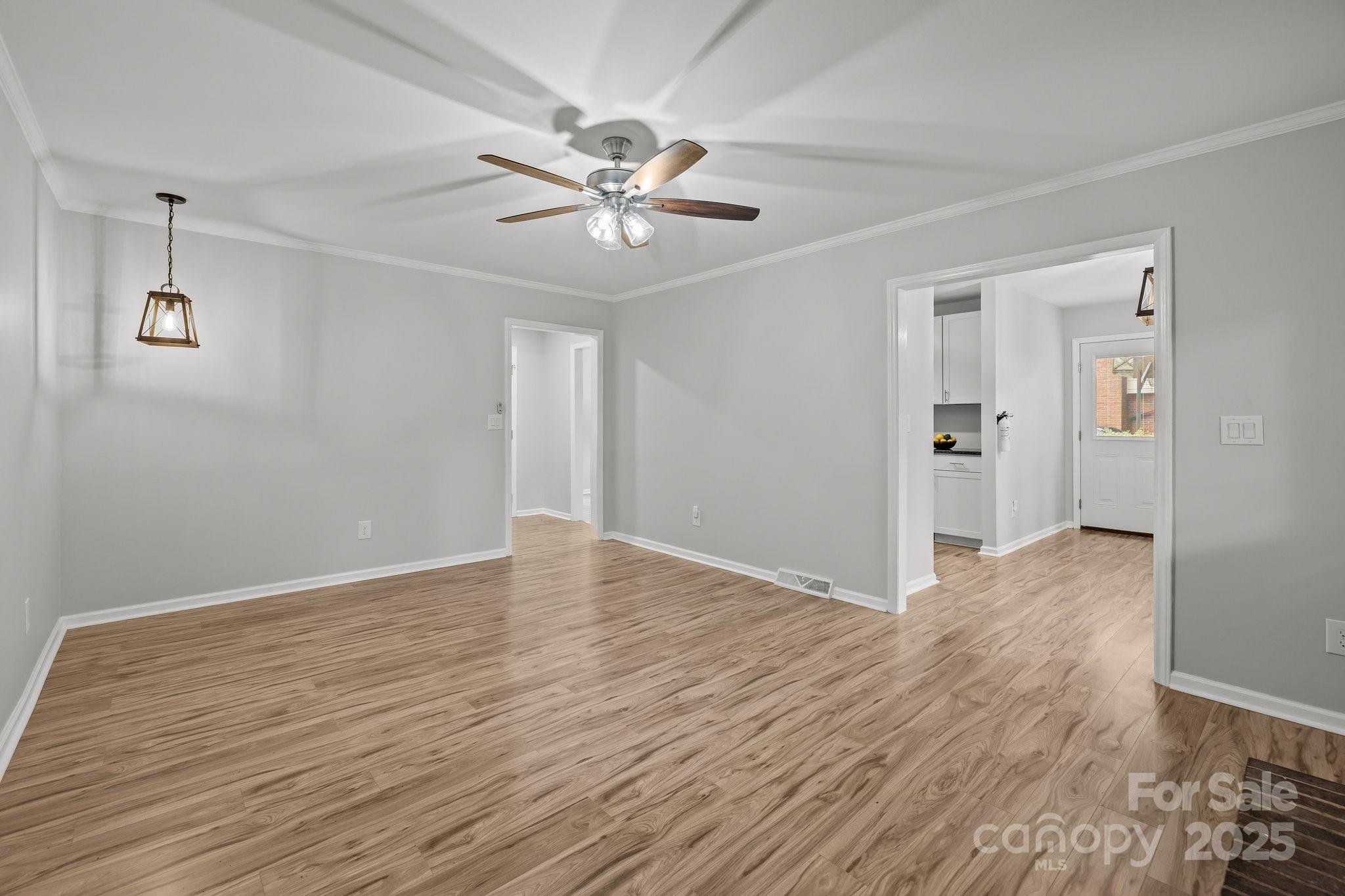13446 Idlefield Lane Matthews, NC 28105 - Photo 16 of 42 a view of an empty room with wooden floor