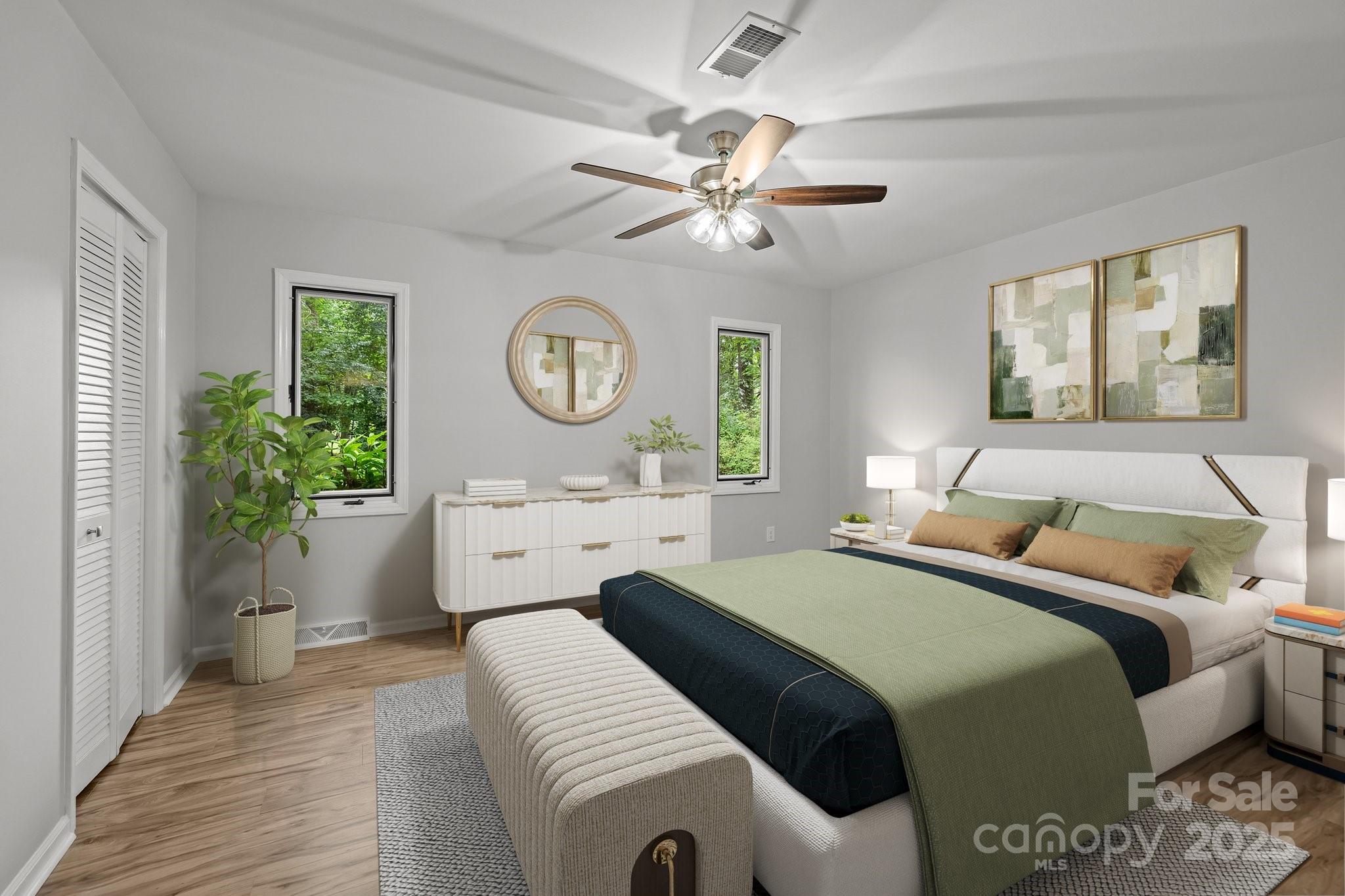 13446 Idlefield Lane Matthews, NC 28105 - Photo 17 of 42 a bedroom with a bed and a chandelier