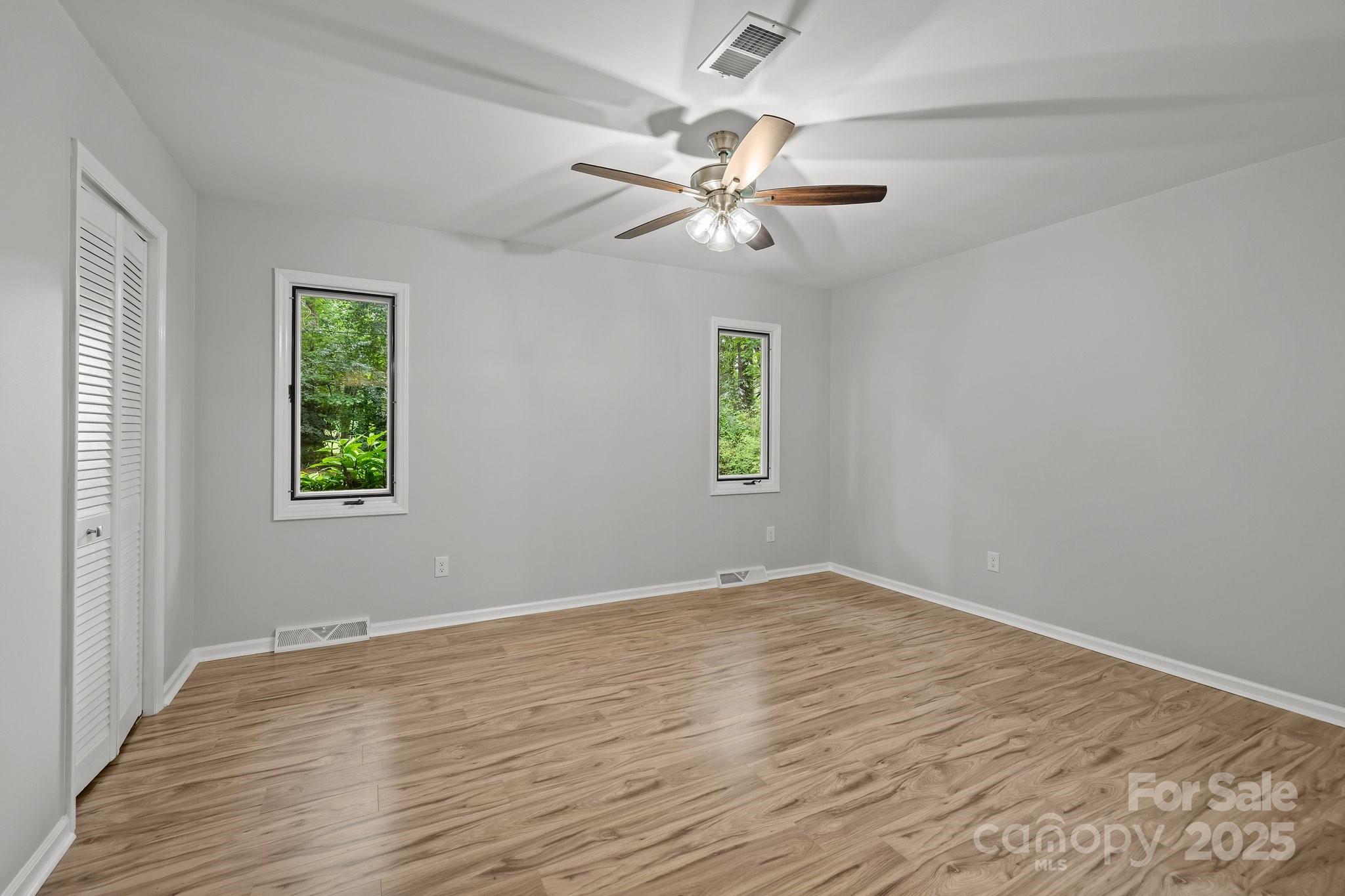 13446 Idlefield Lane Matthews, NC 28105 - Photo 18 of 42 wooden floor in an empty room with a window