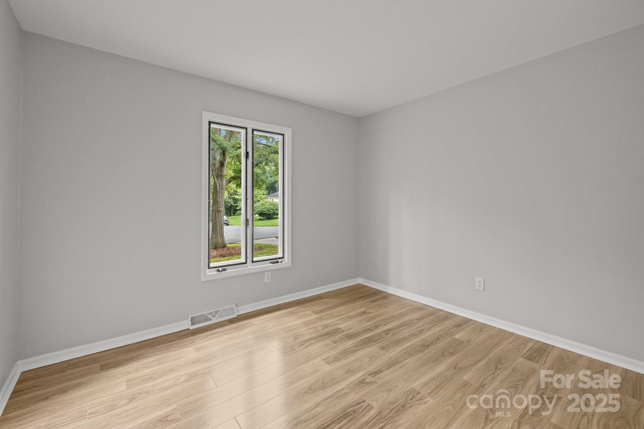 13446 Idlefield Lane Matthews, NC 28105 - Photo 22 of 42 a view of an empty room with a window
