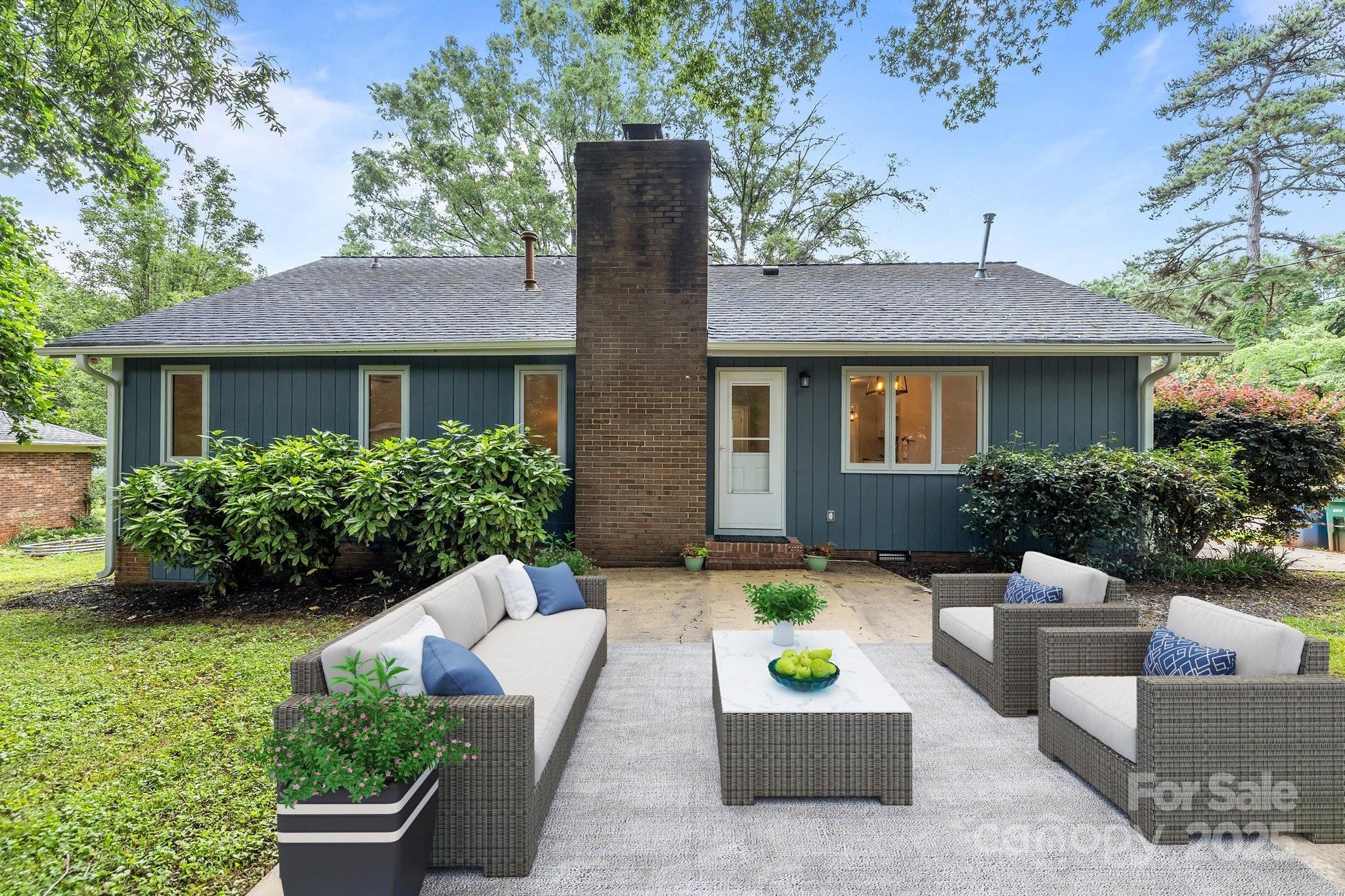 13446 Idlefield Lane Matthews, NC 28105 - Photo 28 of 42 a view of a house with a yard and furniture