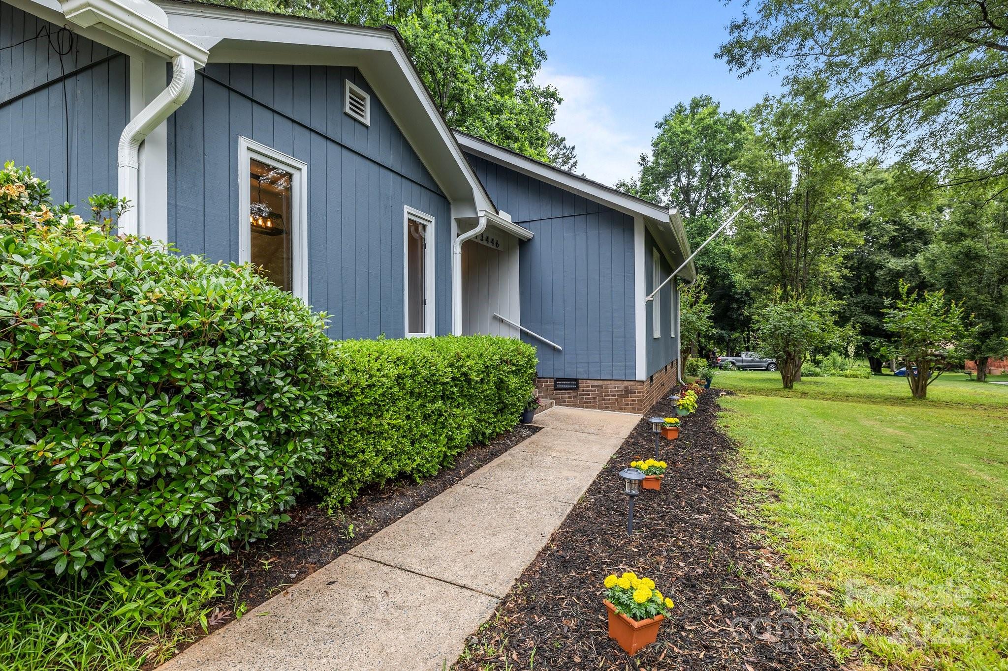 13446 Idlefield Lane Matthews, NC 28105 - Photo 34 of 42 a front view of a house with a yard