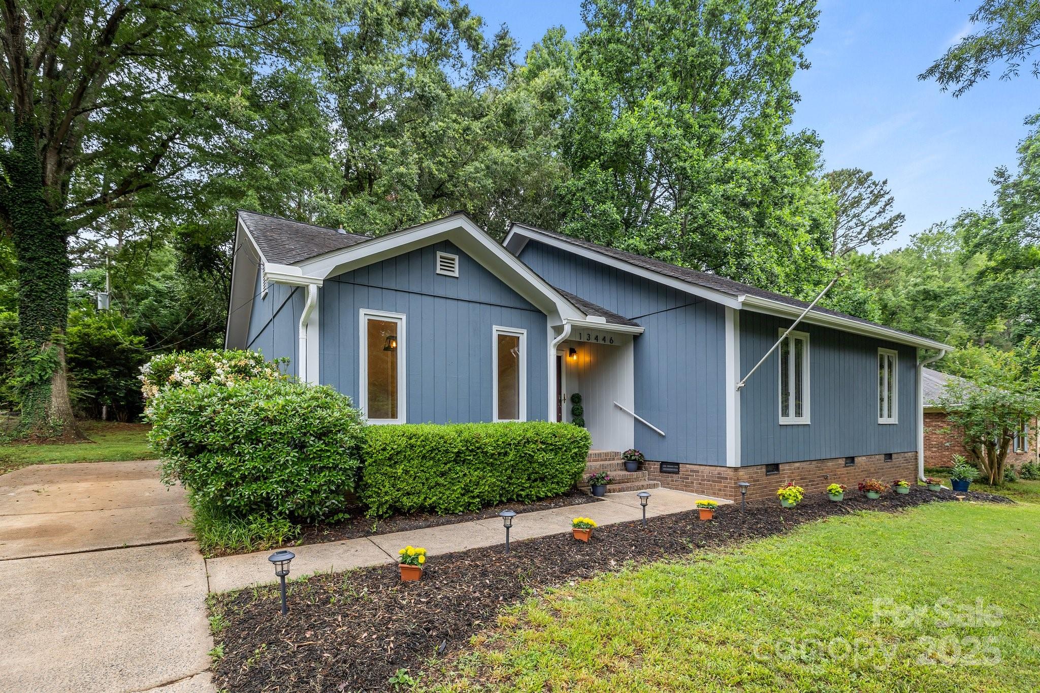 13446 Idlefield Lane Matthews, NC 28105 - Photo 35 of 42 a front view of house with yard and trees
