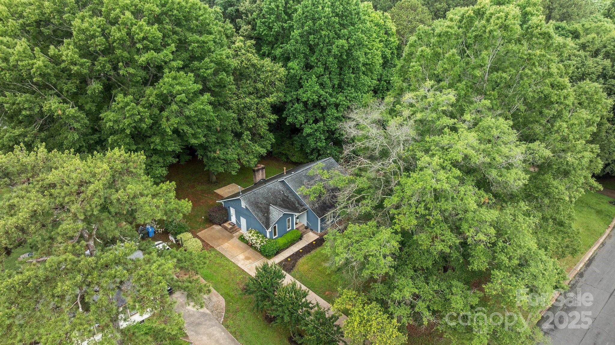 13446 Idlefield Lane Matthews, NC 28105 - Photo 37 of 42 an aerial view of a house with a yard