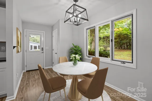 a dining room with furniture and window