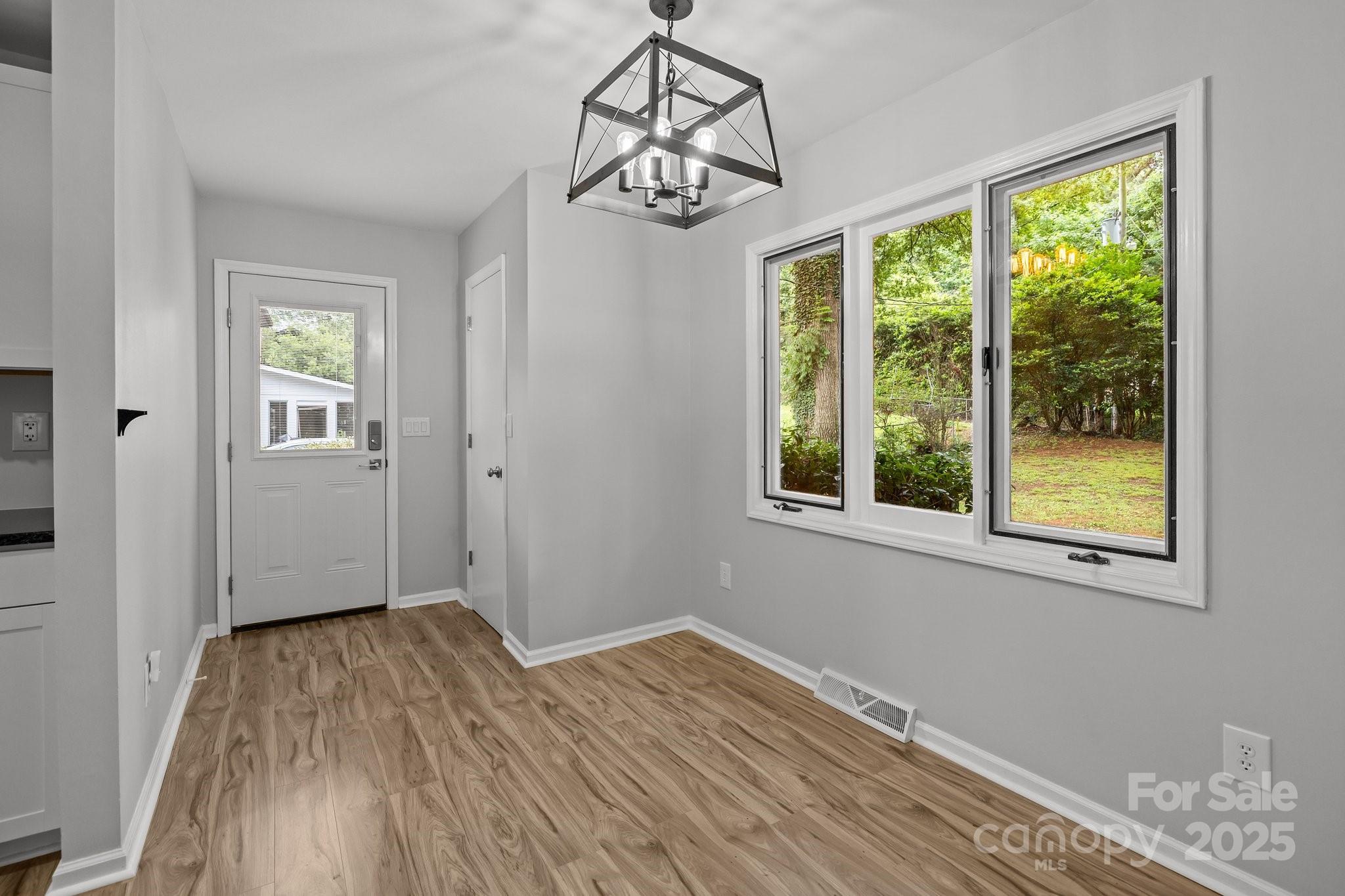 13446 Idlefield Lane Matthews, NC 28105 - Photo 7 of 42 a view of a room with wooden floor cabinet and windows