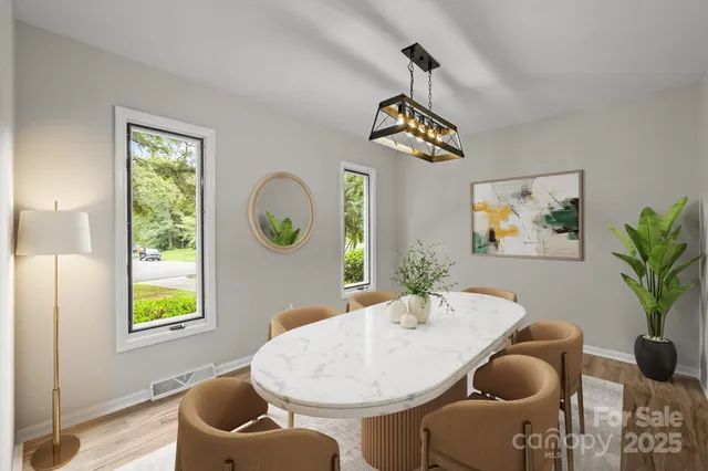a dining room with furniture and window