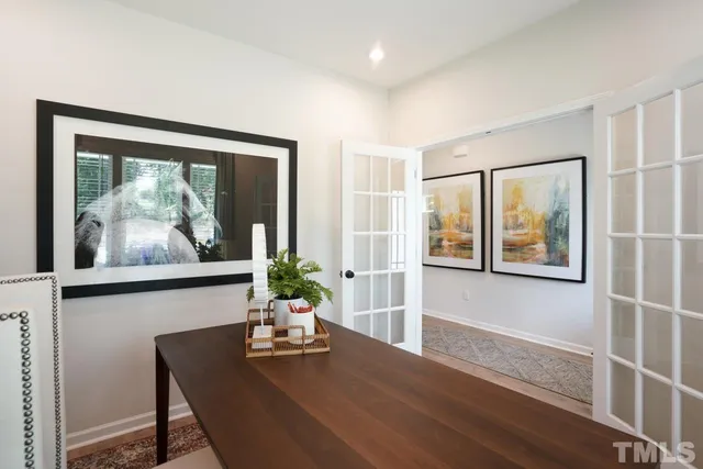 a bathroom with a sink a toilet and a large mirror