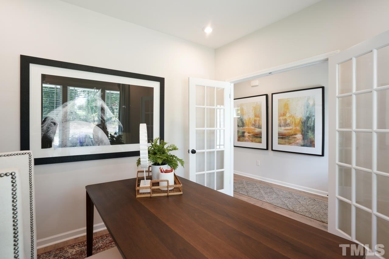 232 Brody Pine Way Garner, NC 27529 - Photo 14 of 35 a living room with furniture and a painting on the wall