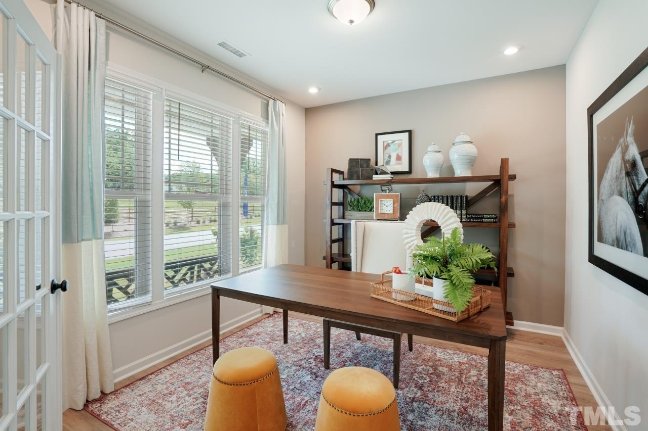232 Brody Pine Way Garner, NC 27529 - Photo 15 of 35 a living room with furniture and a potted plant