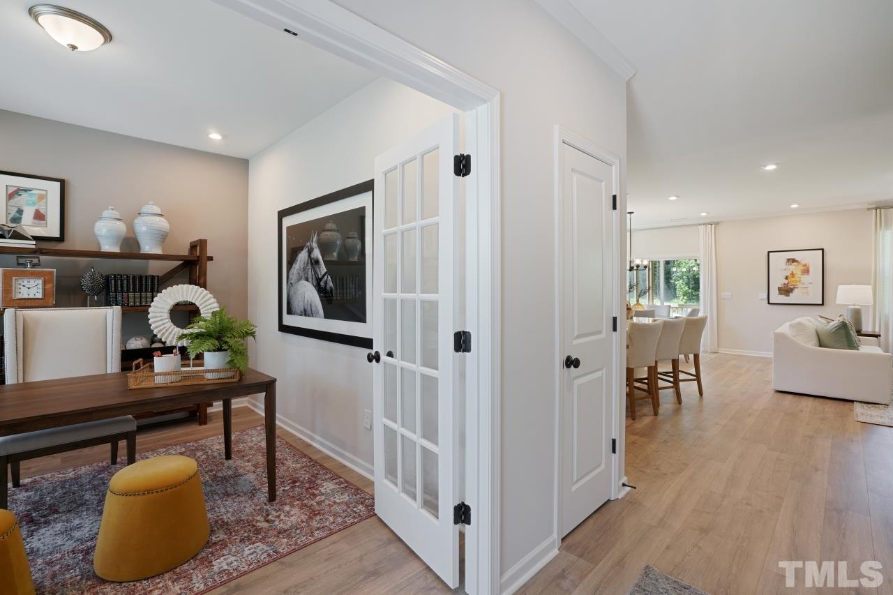 232 Brody Pine Way Garner, NC 27529 - Photo 16 of 35 a living room with furniture and a wooden floor