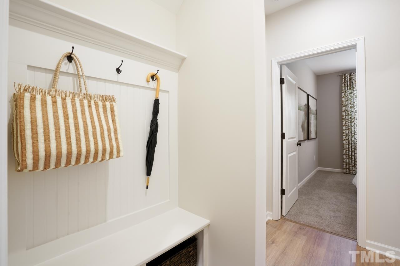 232 Brody Pine Way Garner, NC 27529 - Photo 17 of 35 a view of a hallway with entryway and stairs