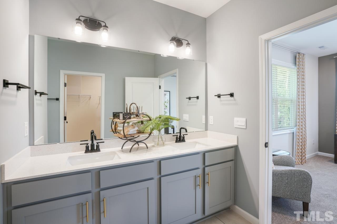 232 Brody Pine Way Garner, NC 27529 - Photo 22 of 35 a bathroom with a sink and a mirror