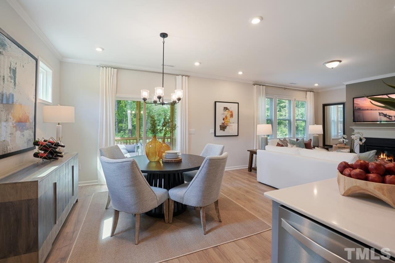 232 Brody Pine Way Garner, NC 27529 - Photo 8 of 35 a view of a dining room with furniture window and outside view