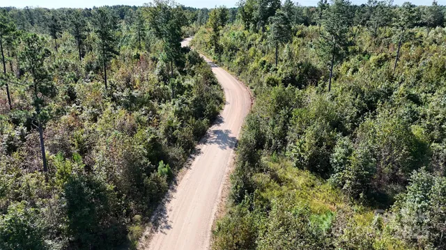 a view of a lake with a house in a yard