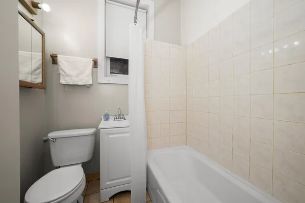 a view of a small space with wooden floor