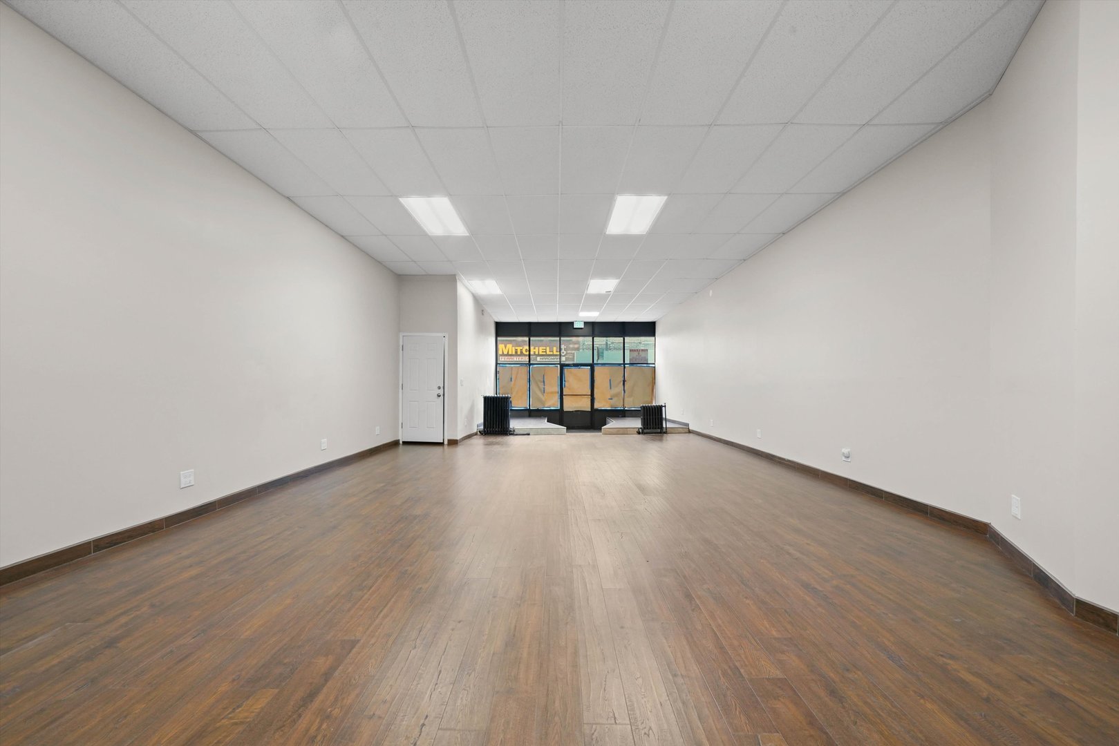 2140 West Cermak Road Chicago, IL 60608 - Photo 22 of 43 a view of an empty room with wooden floor