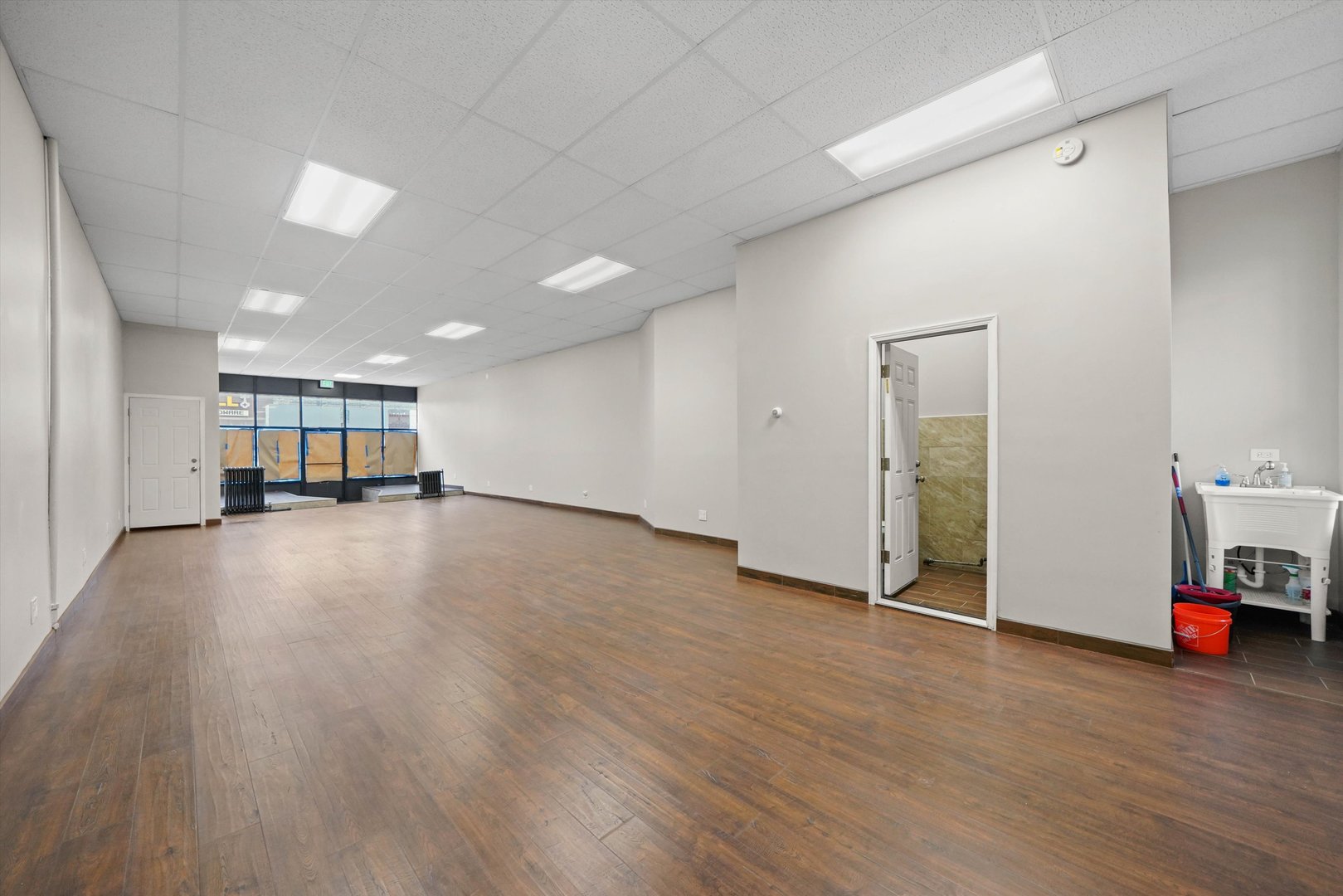 2140 West Cermak Road Chicago, IL 60608 - Photo 23 of 43 a view of empty room with a window and couch