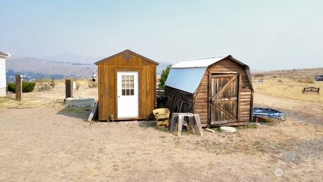 a vase with flowers on the side of it