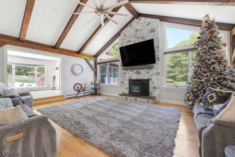 26 Danville Mountain Road Great Meadows, NJ 07838 - Photo 12 of 49 a living room with furniture a flat screen tv and a fireplace