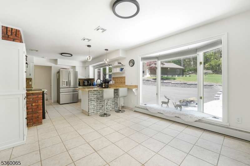 26 Danville Mountain Road Great Meadows, NJ 07838 - Photo 15 of 49 a kitchen with stainless steel appliances kitchen island granite countertop a refrigerator and cabinets