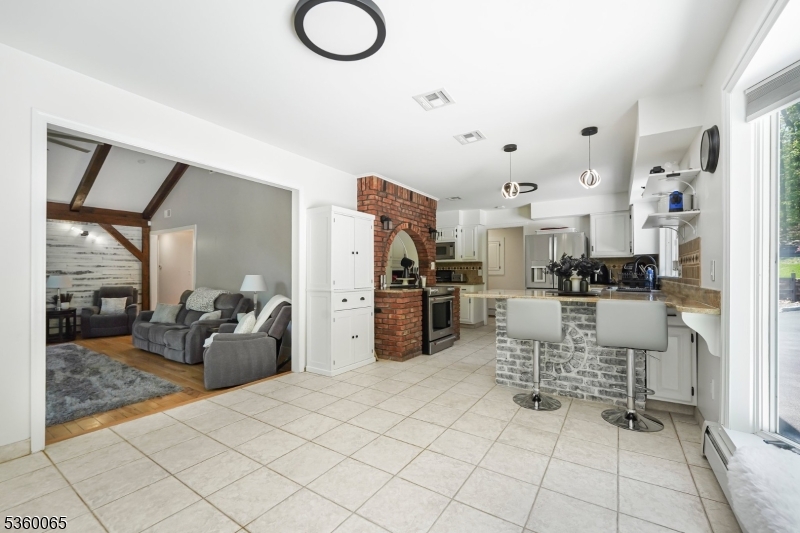 26 Danville Mountain Road Great Meadows, NJ 07838 - Photo 16 of 49 a kitchen with stainless steel appliances kitchen island granite countertop a refrigerator and microwave