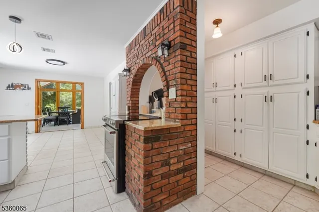 wooden floor view with an entryway and livingroom