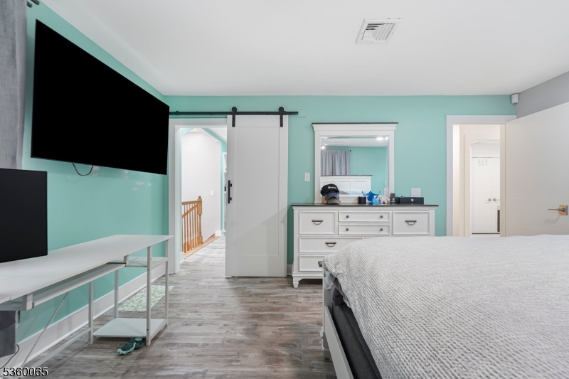 26 Danville Mountain Road Great Meadows, NJ 07838 - Photo 30 of 49 a bedroom with a bed and a flat screen tv