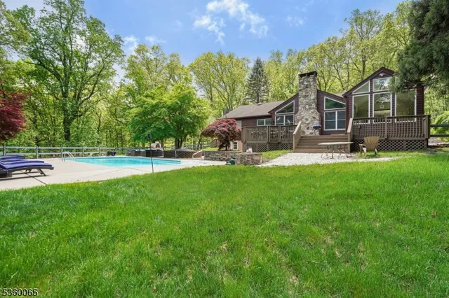 a house view with a sitting space and garden