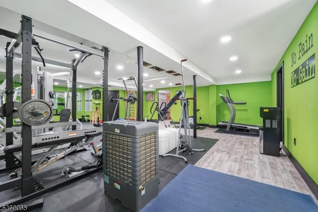 a living room with patio furniture and a large window